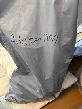 Gray Plastic Packaging Bag with Handwritten Label